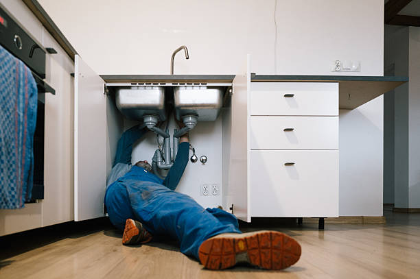 Professional Drain Cleaning technician working in Gravette, AR